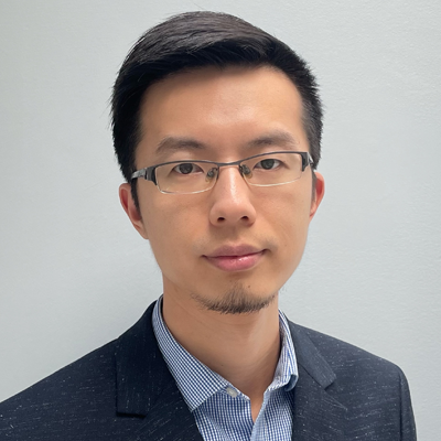 Zhisheng Yan wears a navy suit, shirt, and glasses in his faculty profile for the IST department at George Mason University.