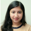 Amrita Ganguly, IST PhD student, wears a beige and blue sweater in her profile.