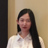 Xinda Wang, IST PhD student at Mason, wears a collared, white shirt in her profile.